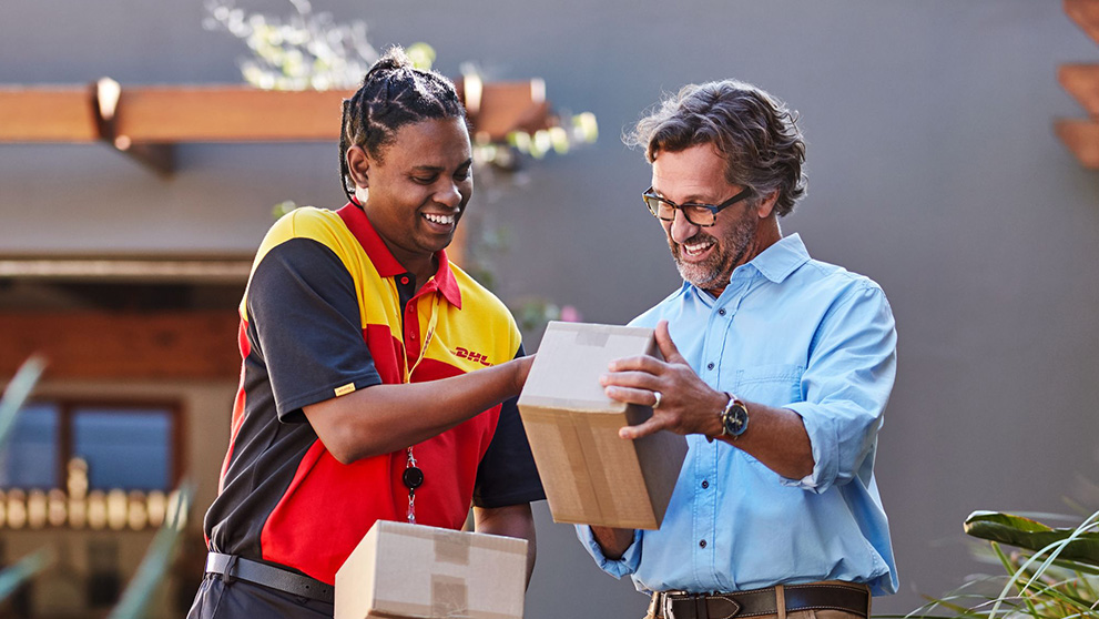 DHL courier handing man parcel