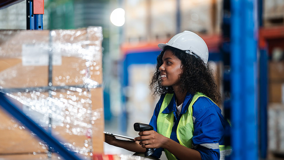 woman smiling in a warehouse