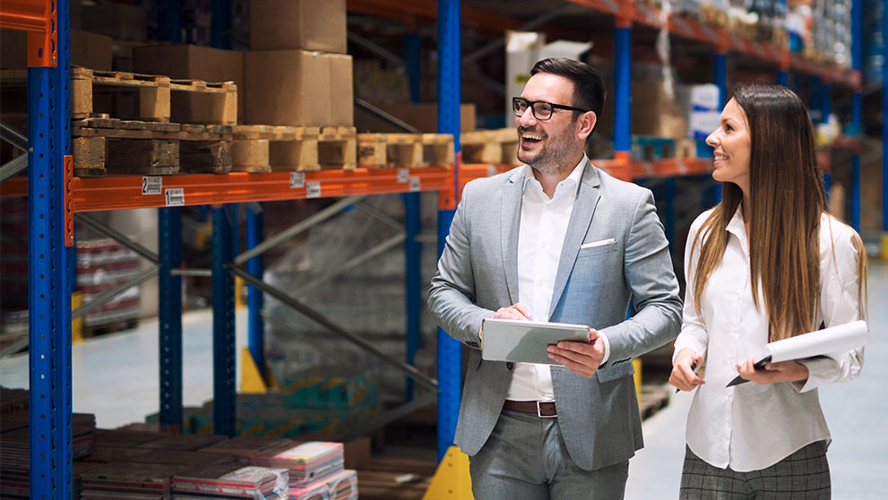 man and woman in warehouse