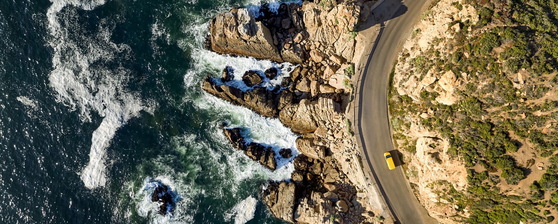 Aerial view of DHL van by the beach