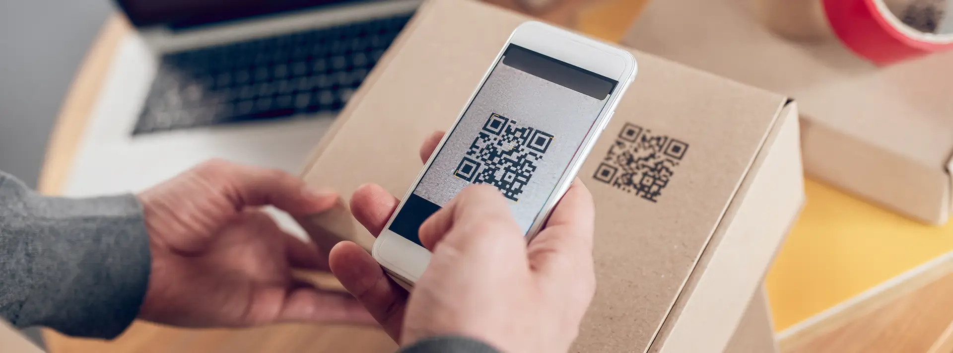 man scanning barcode on parcel