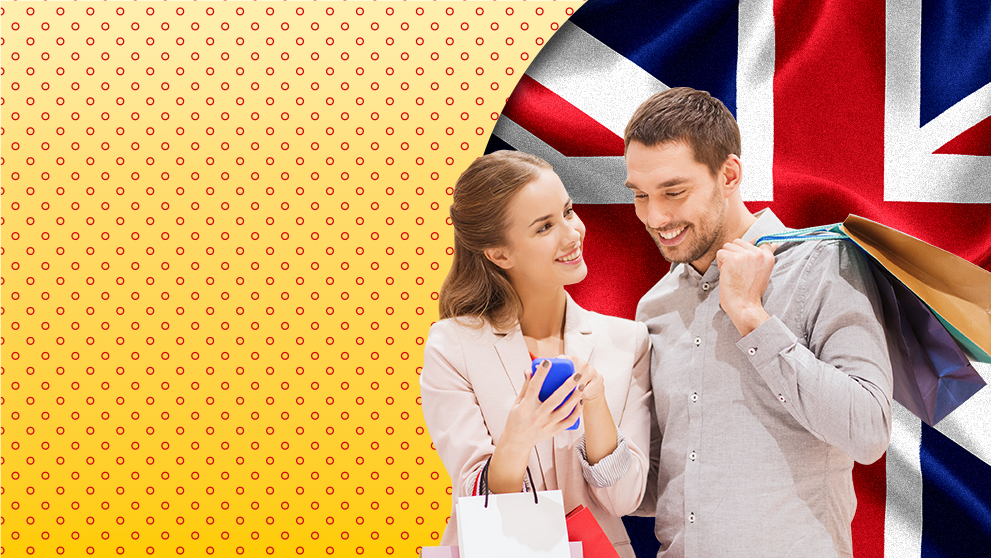 man and woman smiling at mobile phone screen