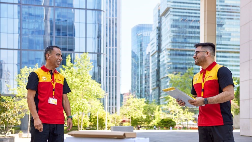 Two DHL Express employees providing expedited shipping services