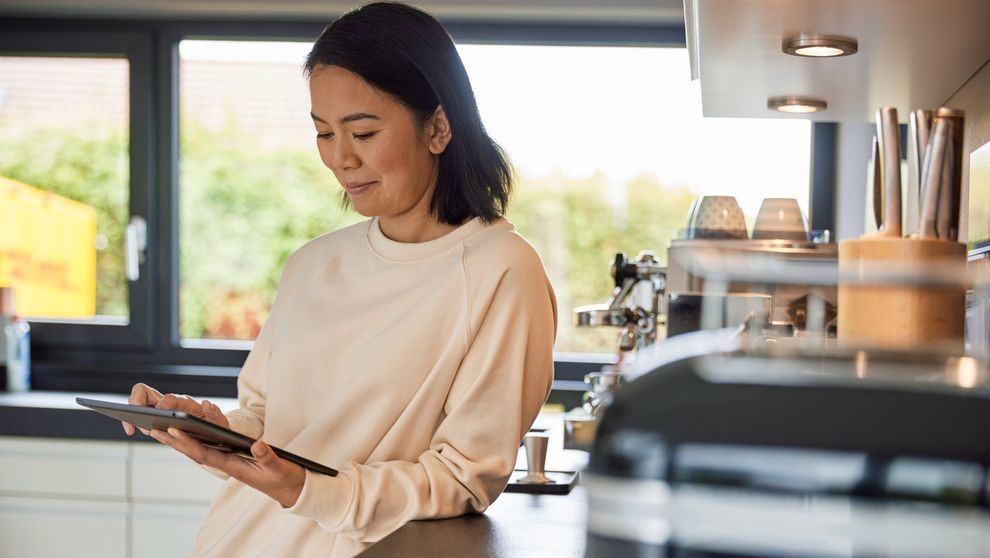 a female business owner using a laptop to compare shipping quotes