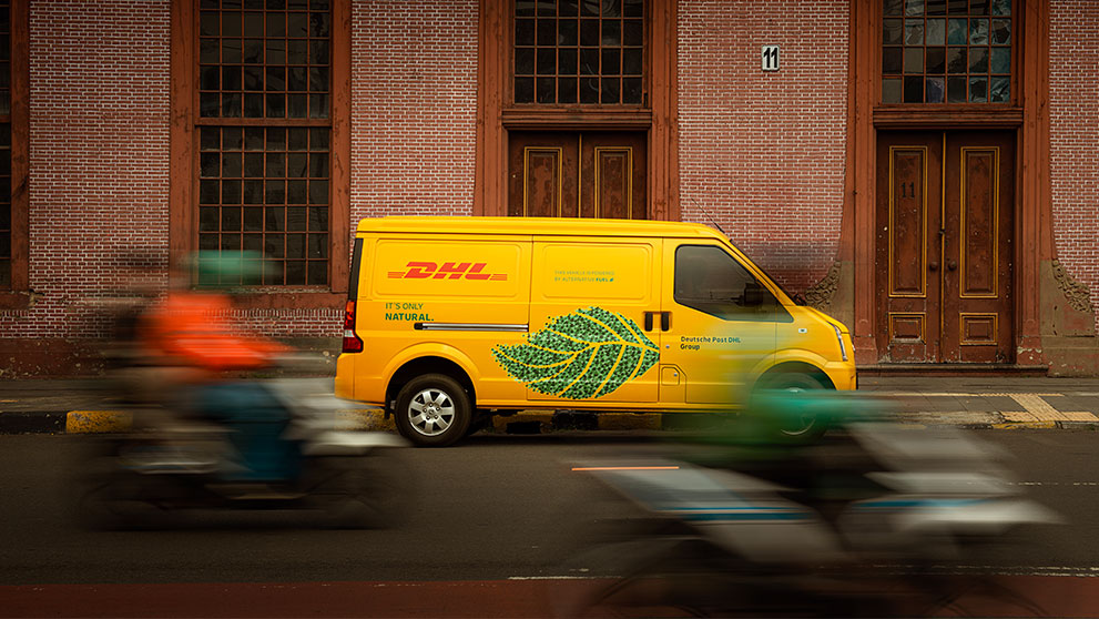 a dhl delivery van showcasing the sustainability of electric vehicles in the logistics industry