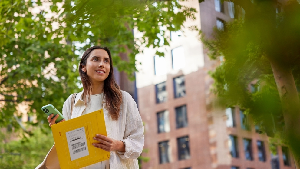 Woman receiving DHL flyer