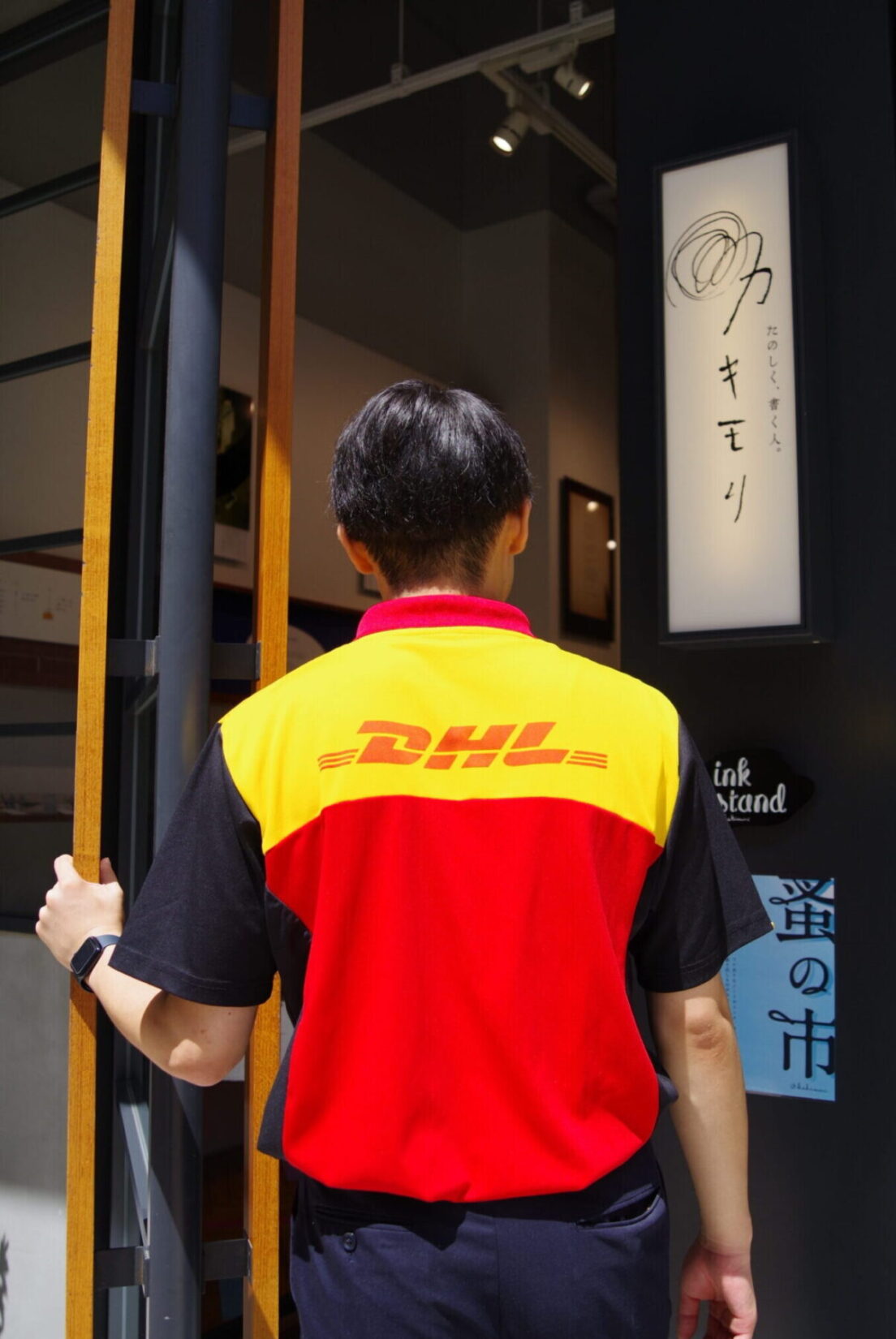 dhl courier entering Kakimori store