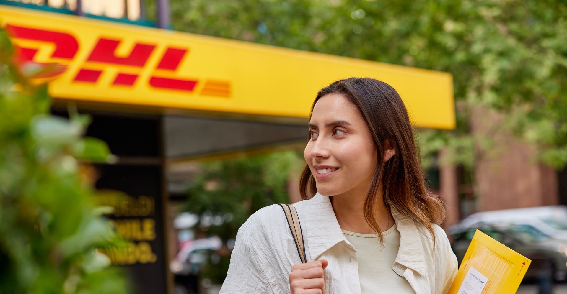 lady walking to dhl express to send documents overseas